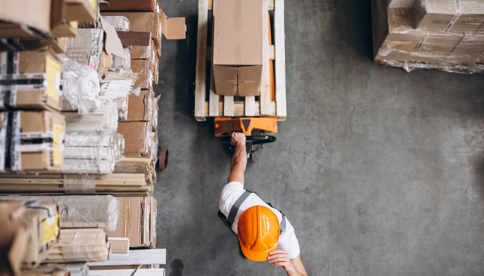 Young Man Working warehouse with boxes 2